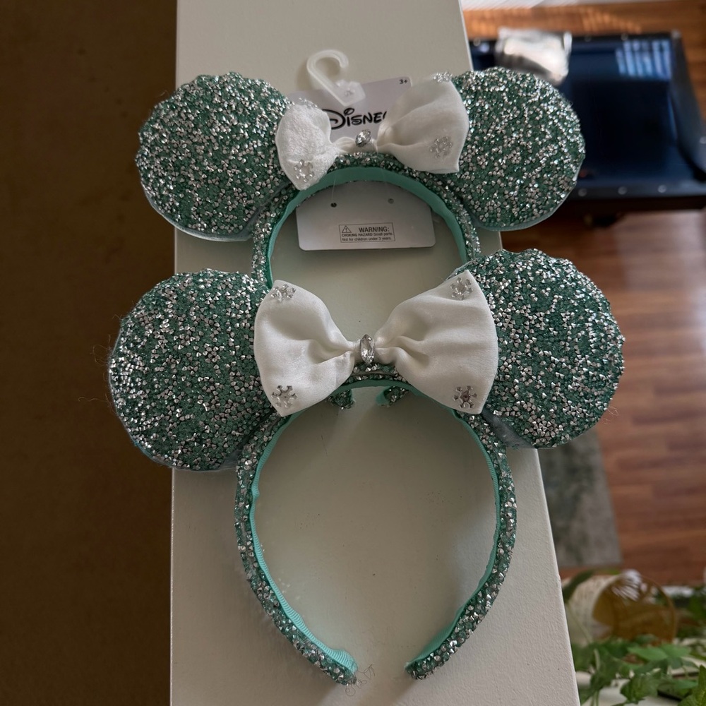 Two Disney Glittery Teal Minnie Mouse Ears with White Bow